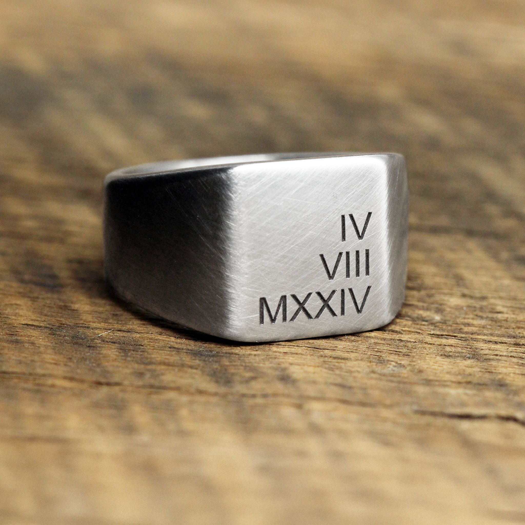 Roman numerals engraved ring man