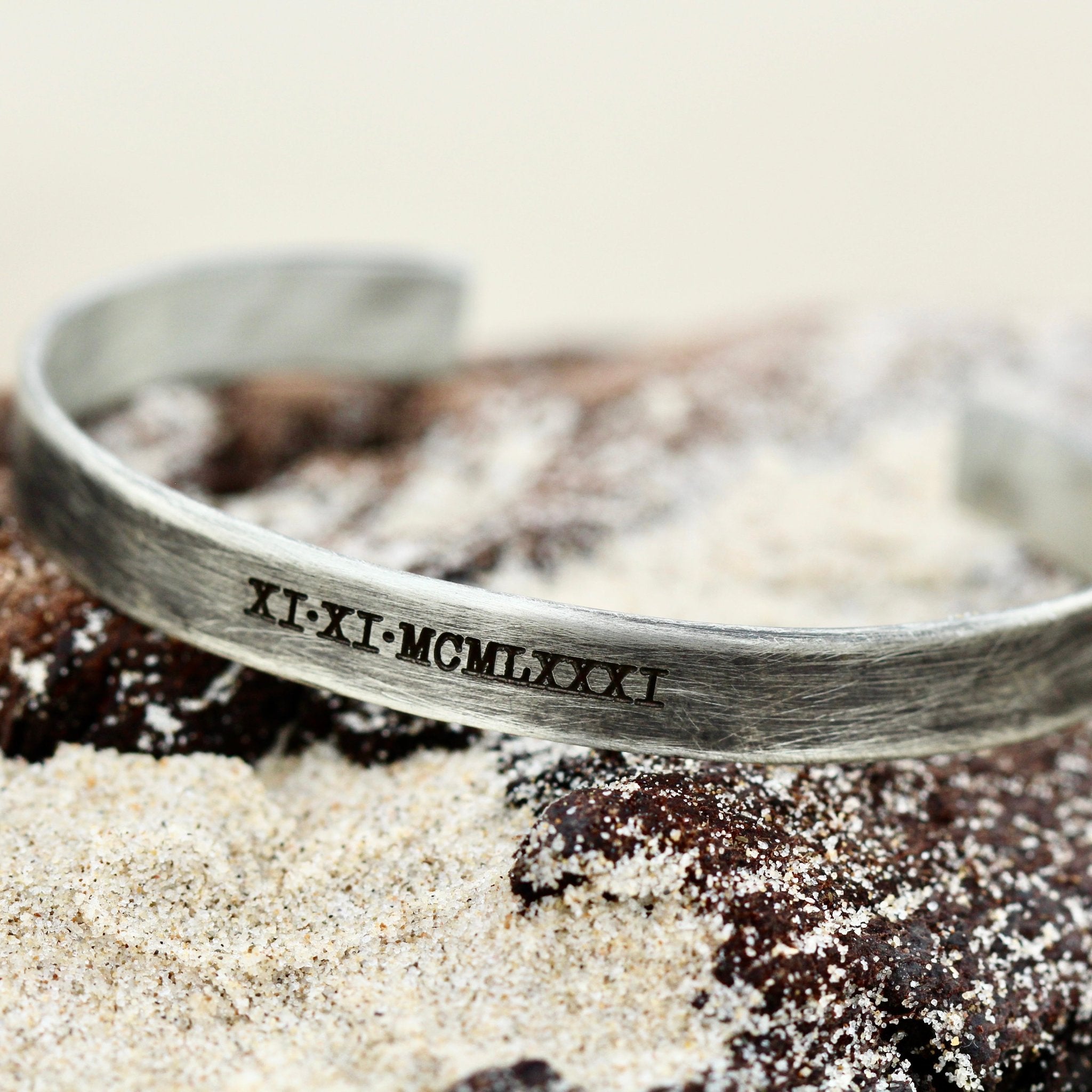 engraved cuff with Roman numerals