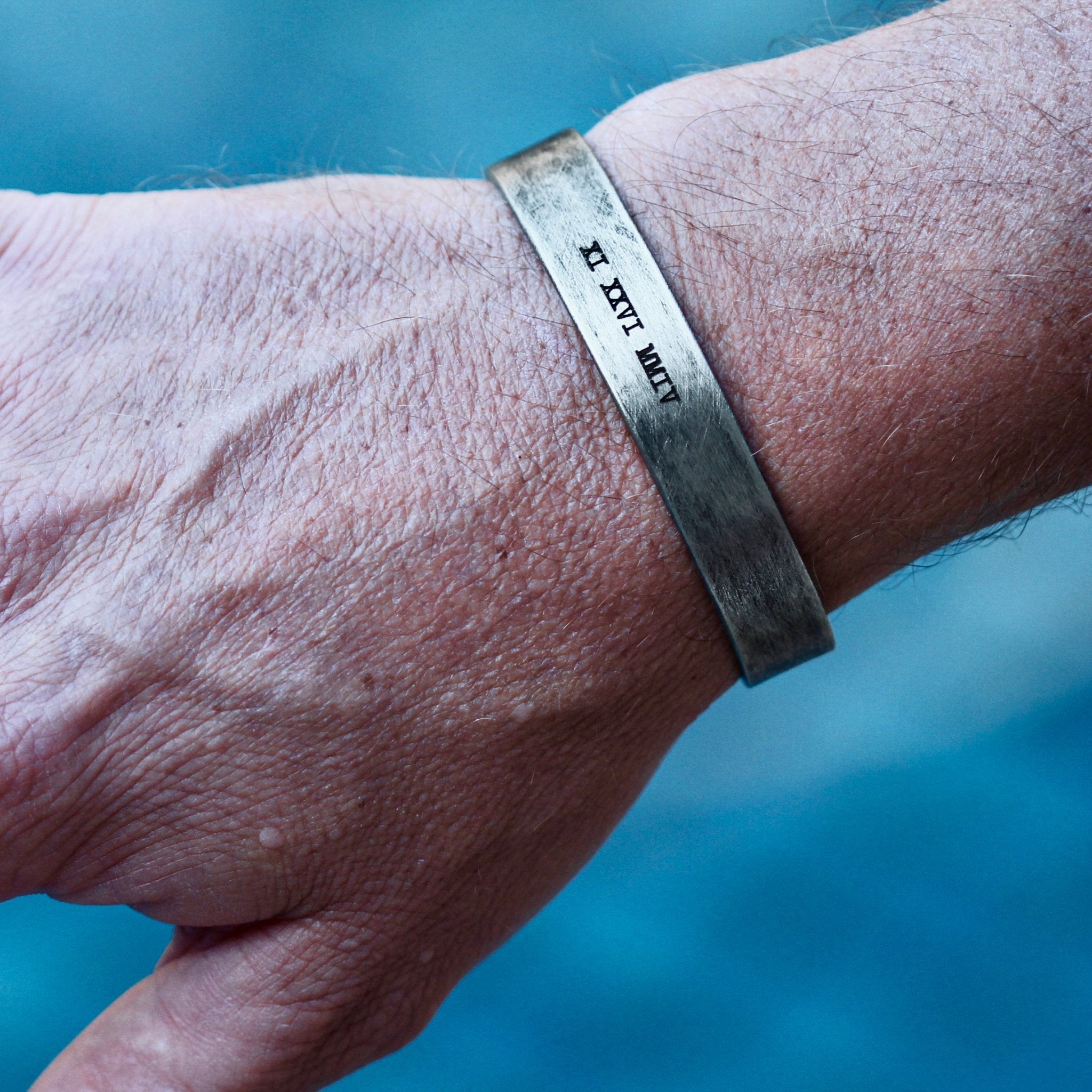 hand-stamped Roman numerals cuff